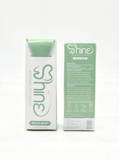 Paperboard packaged toothpaste, named Shine, with green and white packaging colors